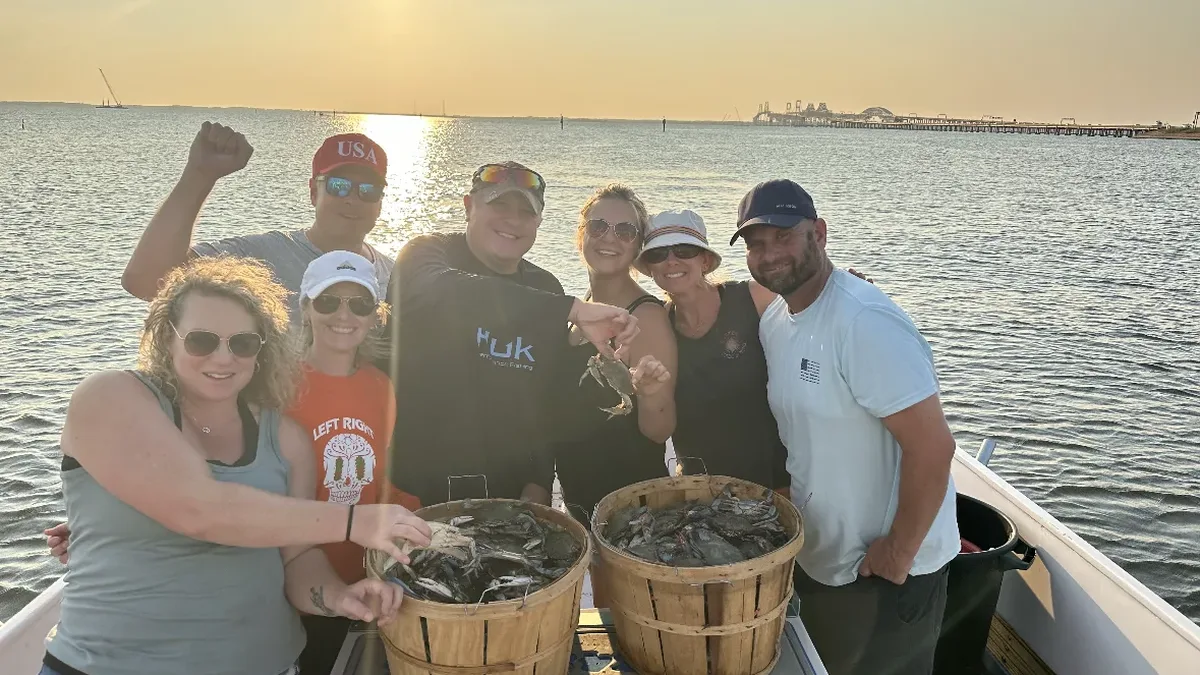 Group crabbing on the Chesapeake Bay at sunset